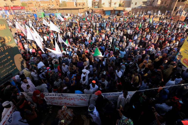 People attend a protest rally in Khartoum
